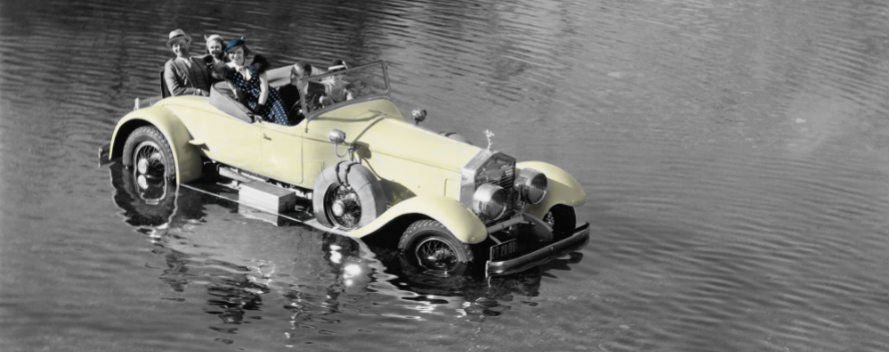 1930s car full of people in lake